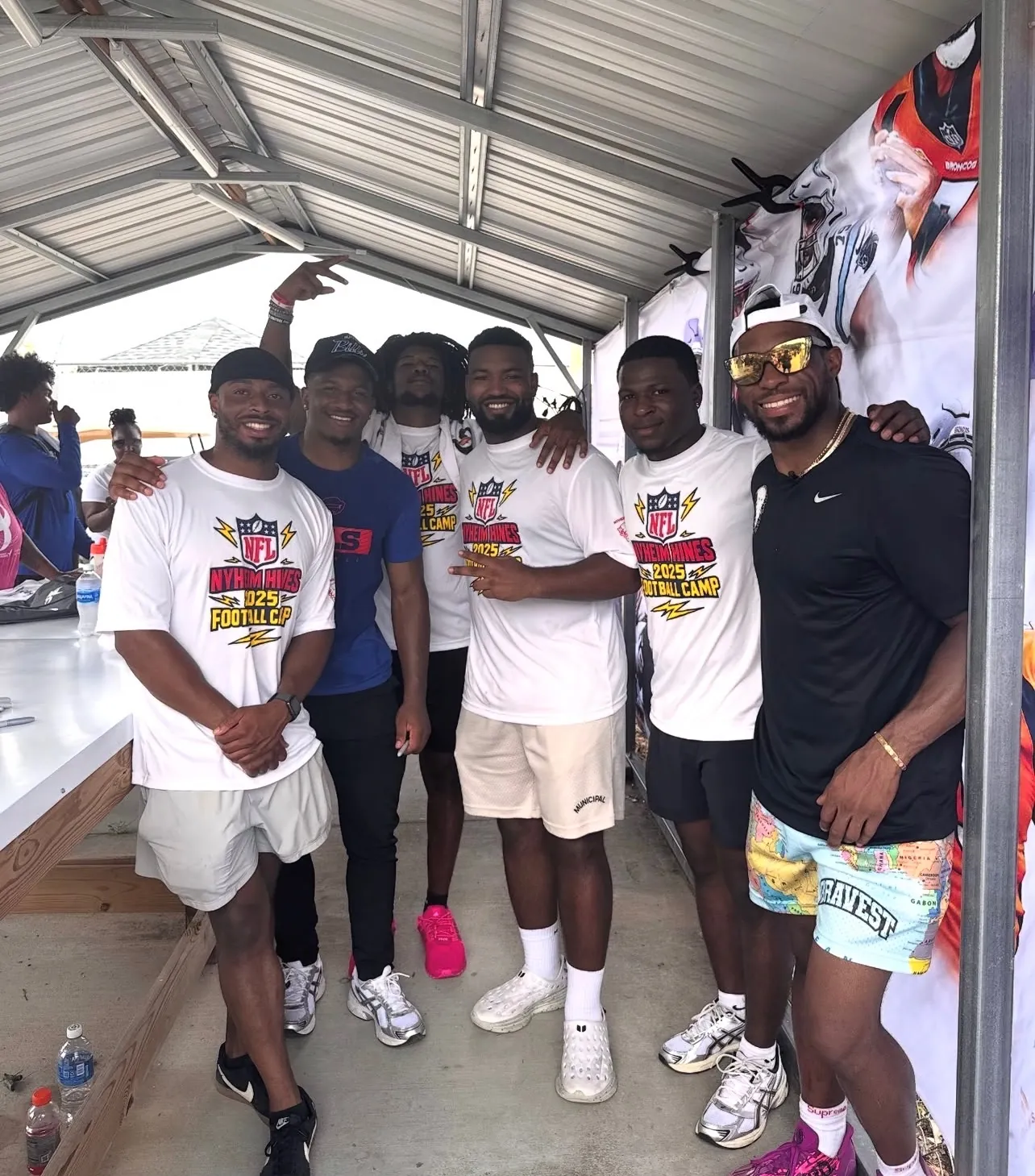 Group photo in camp shirts at a youth football camp