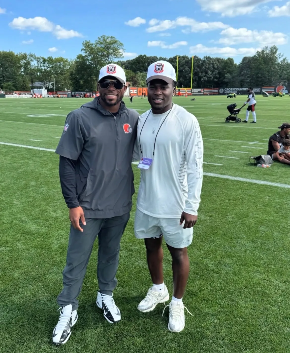 Two men on the practice field at Cleveland Browns training camp